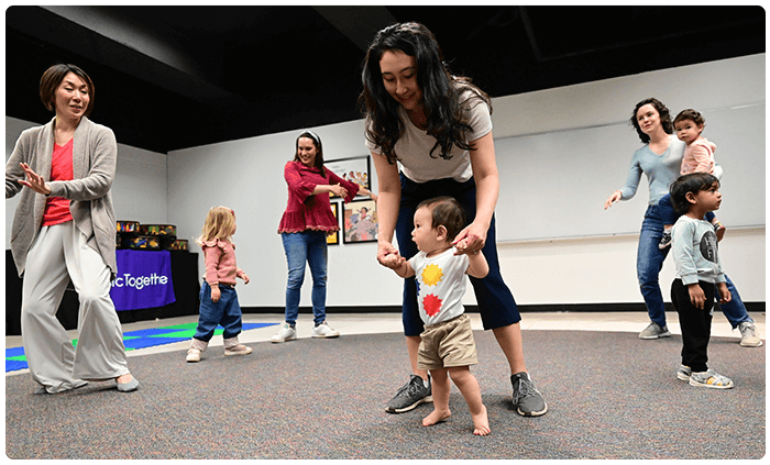 classroom with parents dancing with children