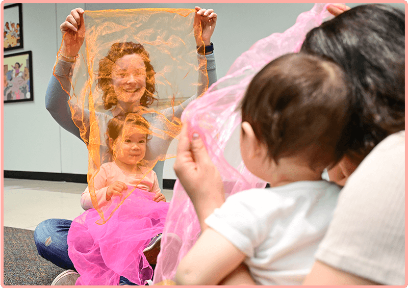 Families connecting through music and scarves