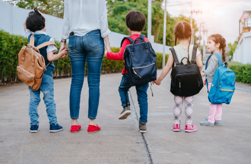 mom walking kids to school